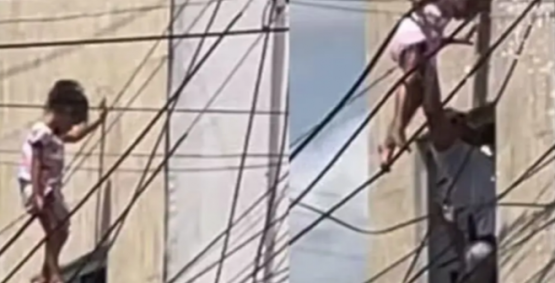 Policial salva menina de 4 anos que ficou pendurada em fios elétricos a 10 metros de altura, em Alagoas