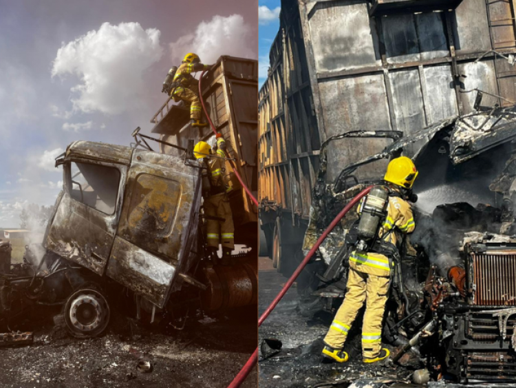 Carreta carregada com bagaço de cana pega fogo na BR-452 e incêndio atinge vegetação, em Rio Verde